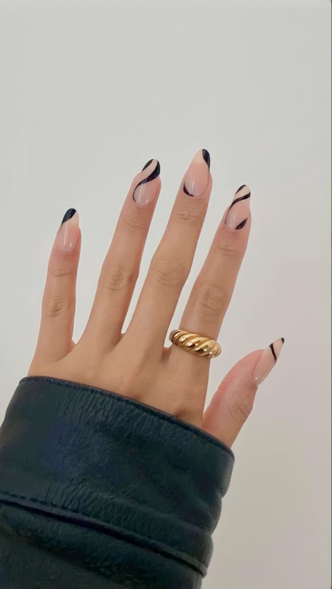 Elegant Nude and Black Nail Design Enhanced by Stylish Gold Ring