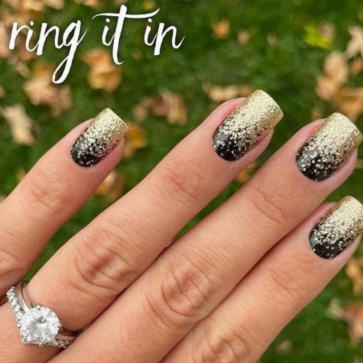 Elegant Ombre Gold-to-Black Gradient Nail Design with Sparkling Texture and Stunning Ring Accents.