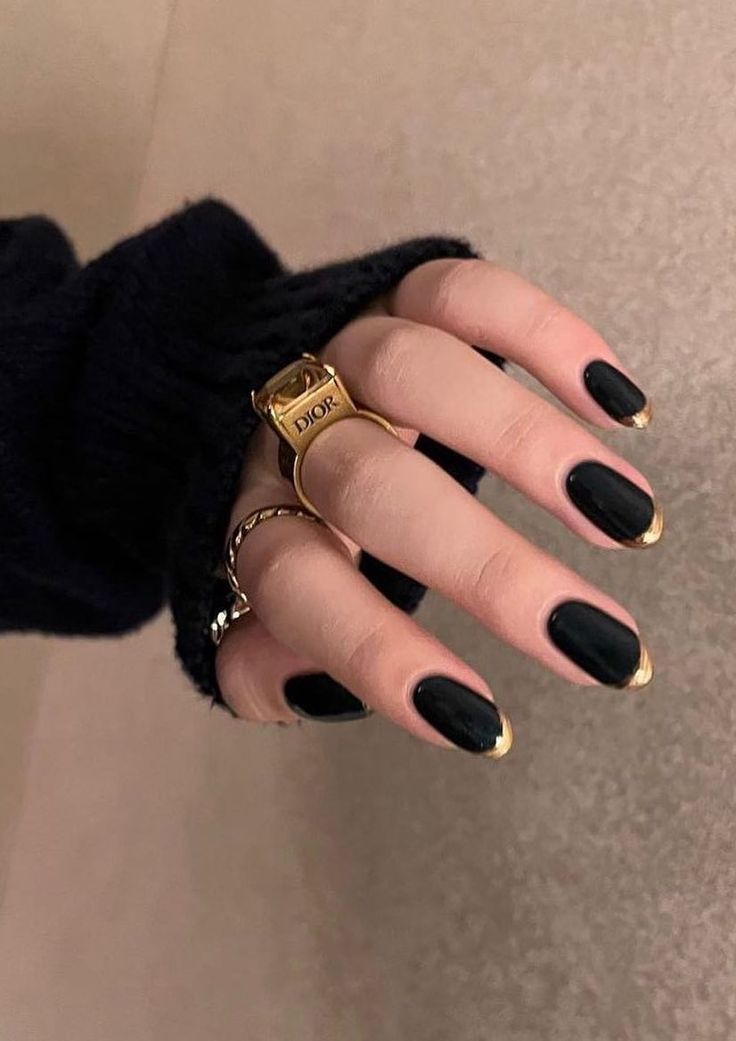 Sophisticated Black Nails with Chic Gold Tips for Timeless Elegance.