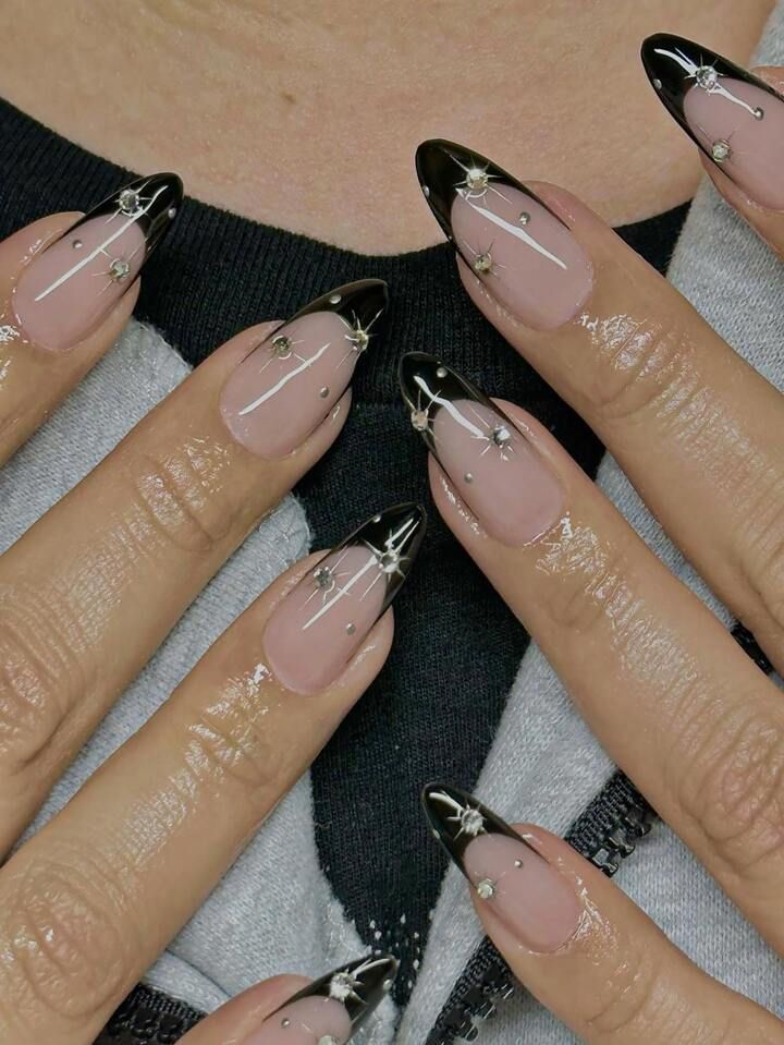 Sophisticated Ombre Stiletto Nails with Glossy Nude Base and Black Tips