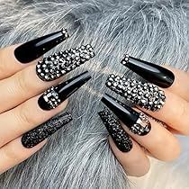 Chic Black Nail Design with Textured Tips and Sparkling Embellishments