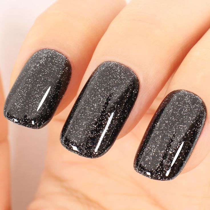 Elegant Sparkling Black Nail Design with Glossy Finish and Subtle Shimmer