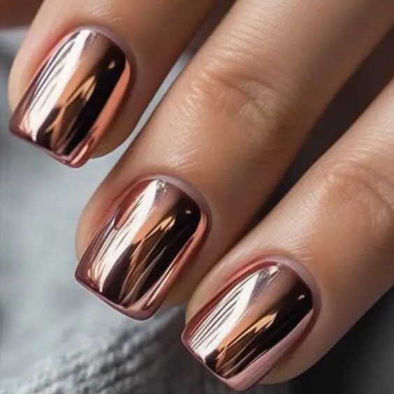 Elegant Rose Gold Metallic Nails: A Chic Finish for Every Occasion.