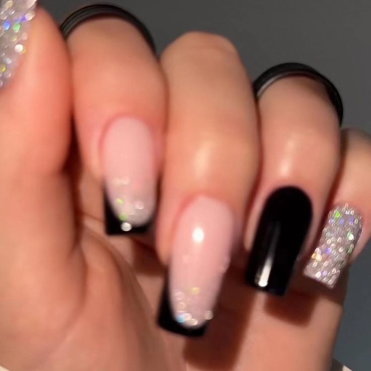 Chic Nail Design: A Stylish Fusion of Textures, Soft Pink, Glossy Black, and Sparkling Rhinestones.