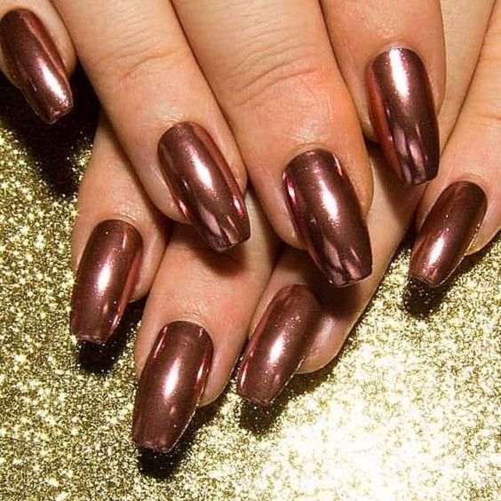 Elegant Radiant Bronze Nail Design with Shimmering Gold Background