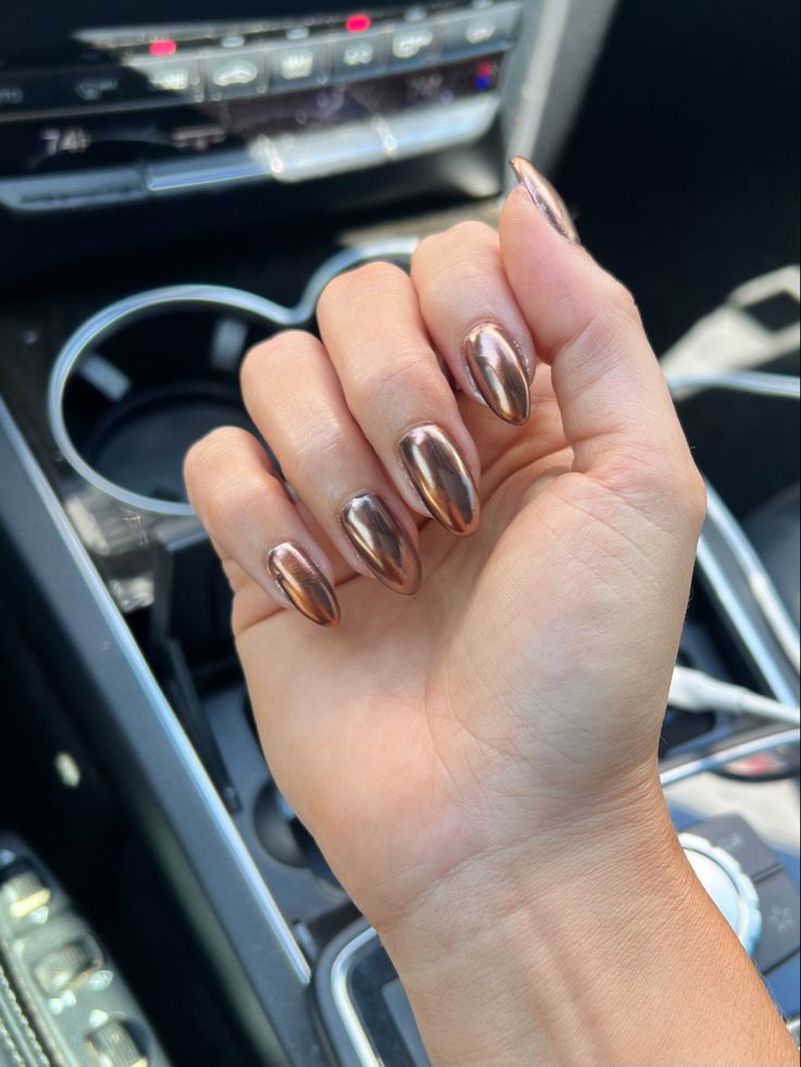 Elegant Metallic Bronze Nails: A Striking Statement of Sophistication.