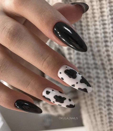 Trendy Cow-Print Nail Design: Bold Contrast and Playful Elegance.