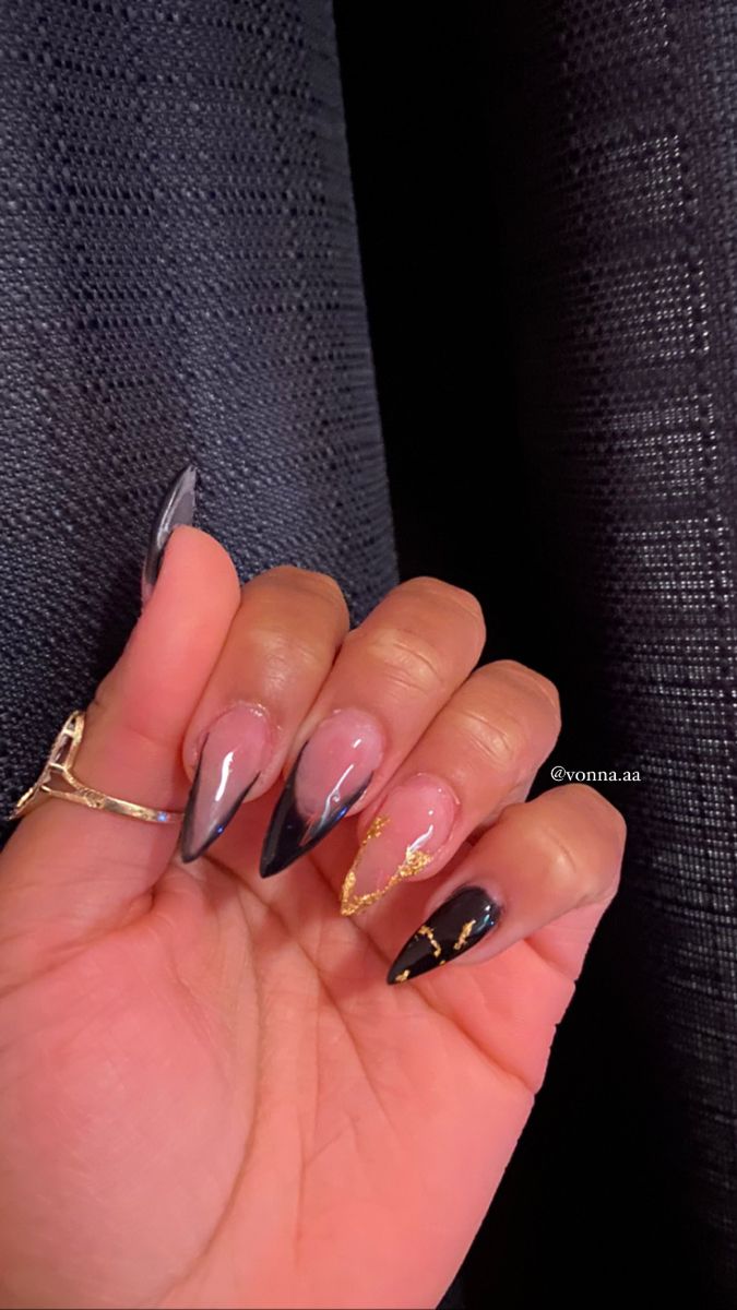 Chic Ombre Nail Design with Gold Accents and Bold Elongated Shape.