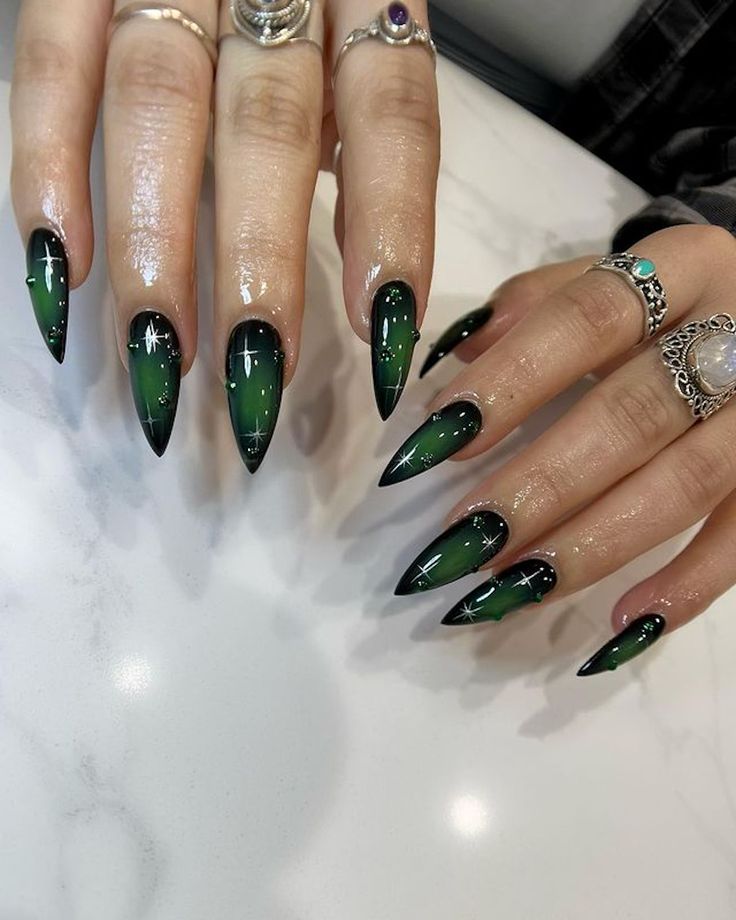 Edgy Gradient Nail Design with Sparkling Accents and Chic Rings