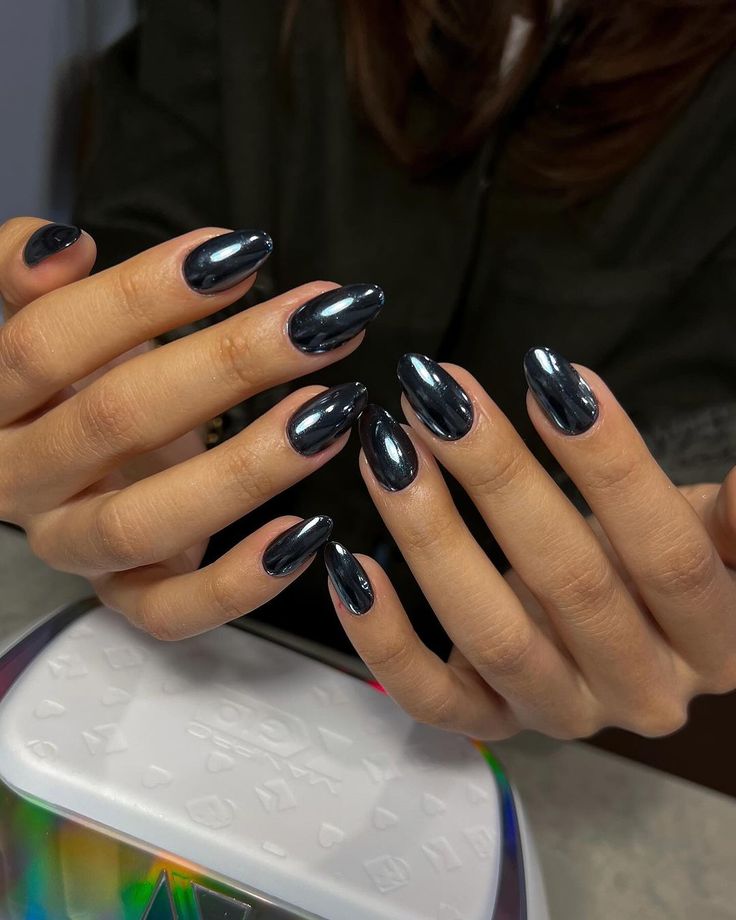 Elegant Glossy Dark Almond Nail Design with Captivating Shine.