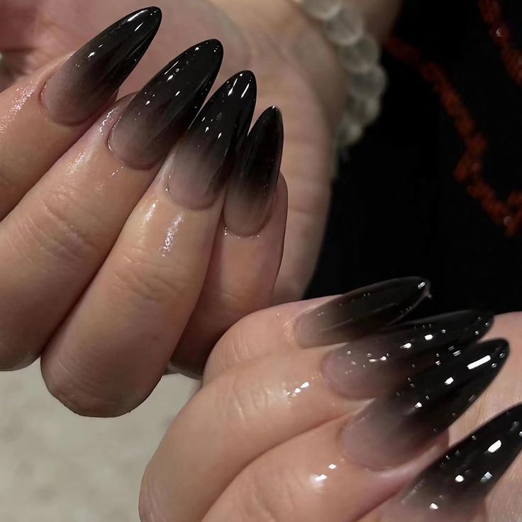 Elegant Ombre Nail Design with Long Pointed Tips and Glossy Finish