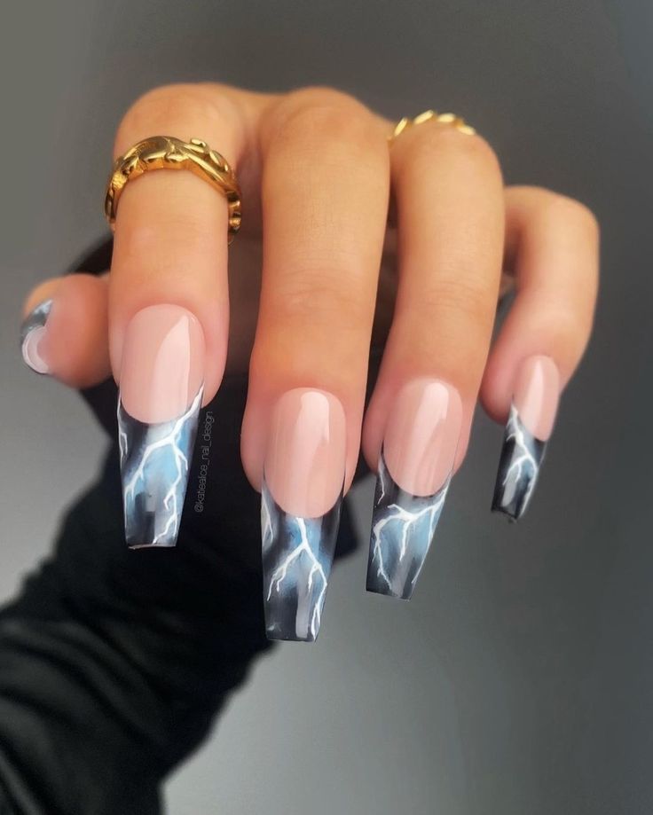 Elegant Nude Nail Design with Bold Lightning Patterns and Gold Accents