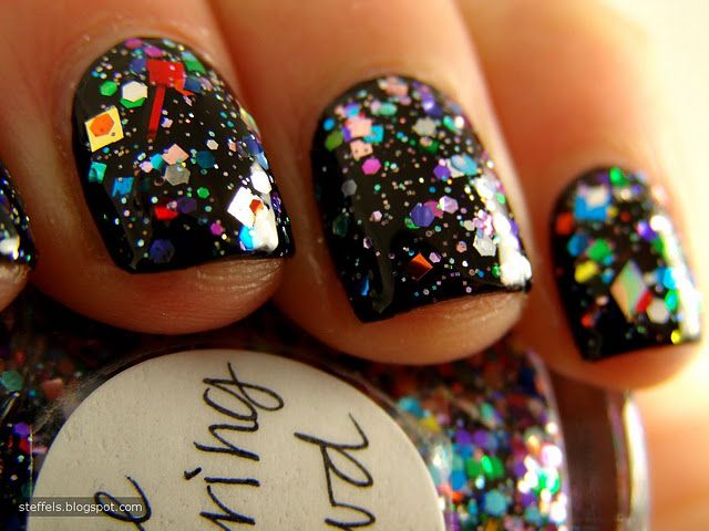 Festive Glossy Black Nail Design with Colorful Glitter Accents.