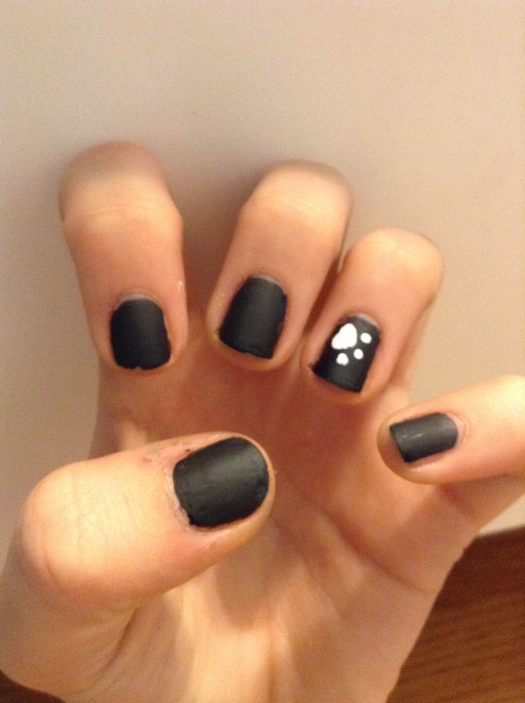 Chic Matte Black Nails with Playful Glossy Accent for a Modern Minimalist Look