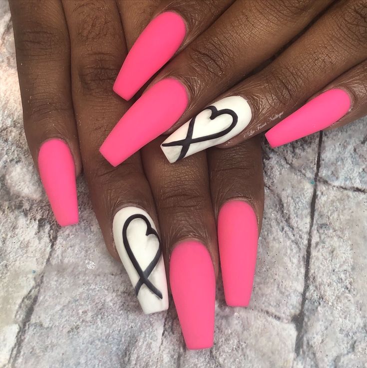 Bold Pink Matte Nails with Elegant Black Heart Accent Design.