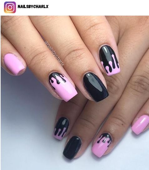 Bold Pink and Black Nail Design with Glossy Dripping Effect.