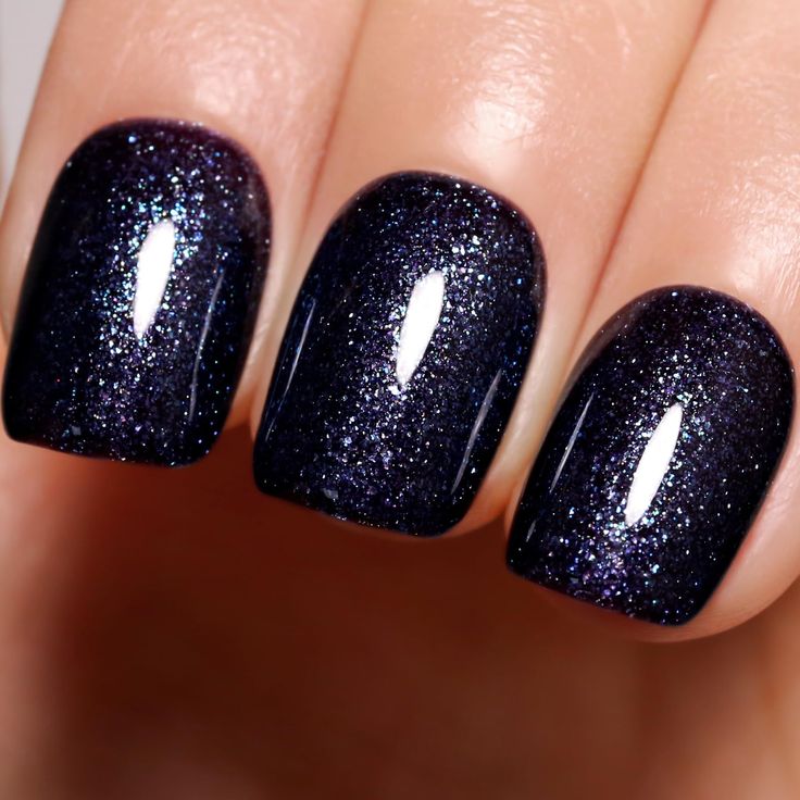 Captivating Glittery Dark Navy Nail Design for Elegant Evening Wear.