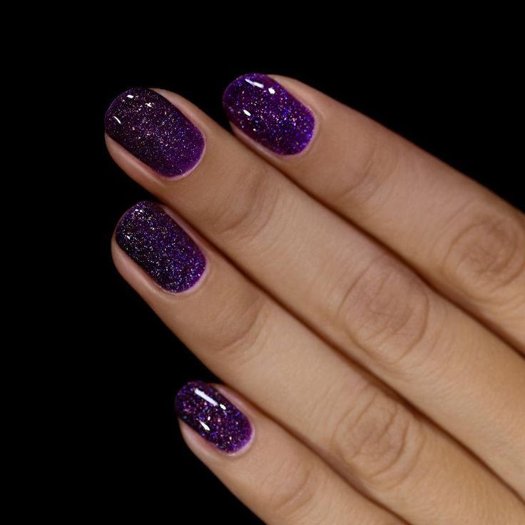 Elegant Gradient Purple Nail Design with Shimmering Glitter for Glamorous Occasions.