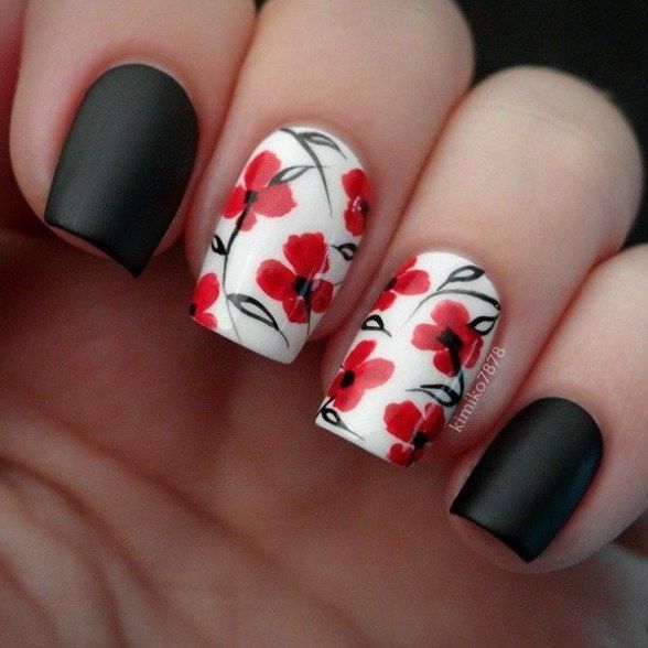 Elegant Floral Nail Design: Matte Black and Glossy White with Red Flowers and Black Vines.