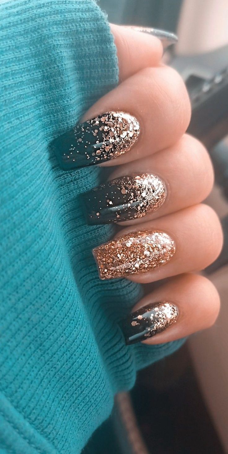 Elegant Glitter Gradient Nails: Dark Base with Shimmering Gold Finish for Festive Glamour.