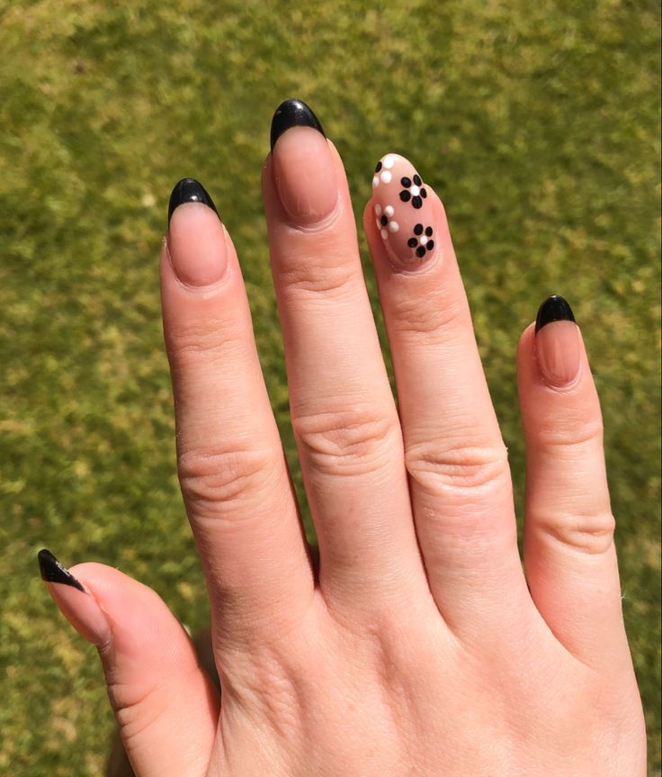 Elegant French Tip Nails with Playful Polka Dot Accent Design