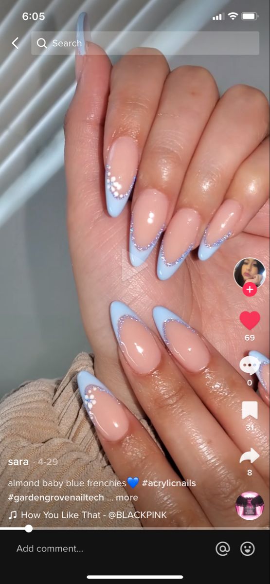 Chic Almond-Shaped Blue French Tip Nails with Sparkling Cuticle Embellishments.