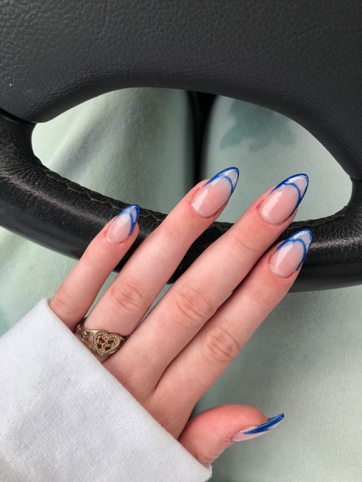 Chic Almond-Shaped Nails: Elegant Nude Base with Striking Blue French Tips