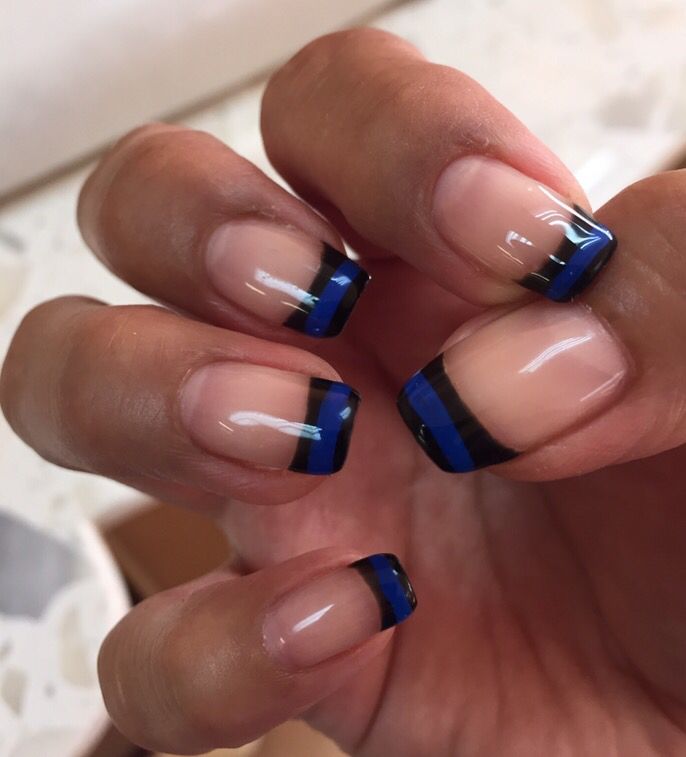 Chic French Manicure with Bold Blue and Black Color Contrasts.