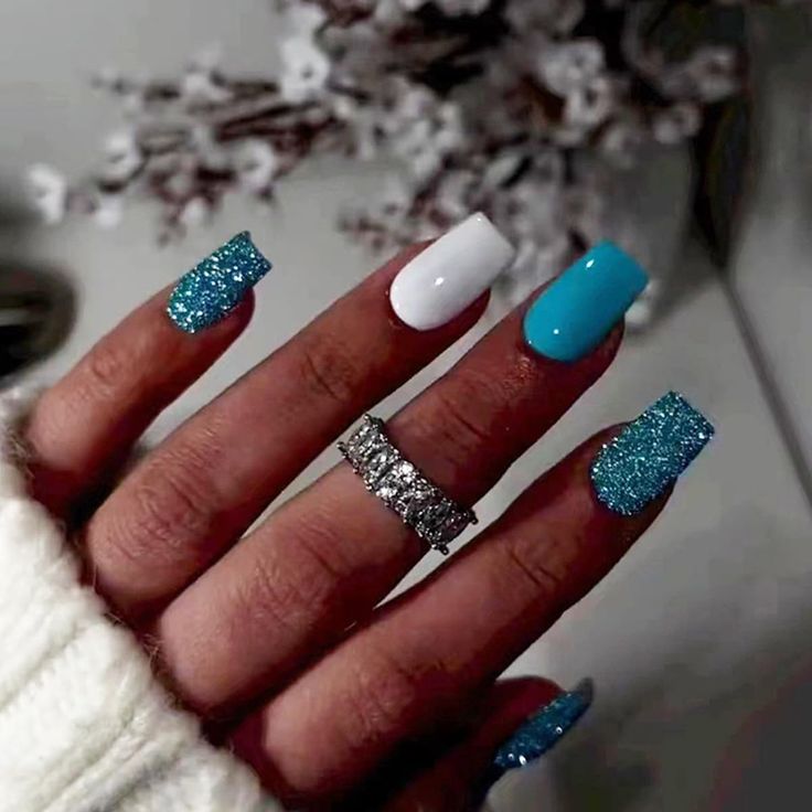 Bold and Glamorous Sparkly Blue and White Nail Design with Complementary Ring.