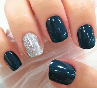 Chic Navy Blue Nail Design with Sparkling Silver Accent for Sophisticated Glamour.