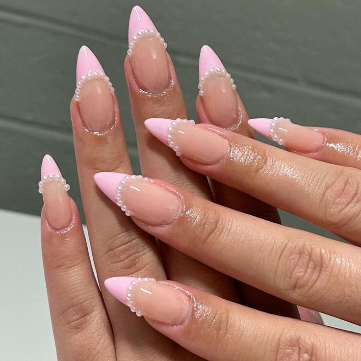 Chic Elegant Nail Design: Sharp Tips with Soft Pink and Pearl Embellishments