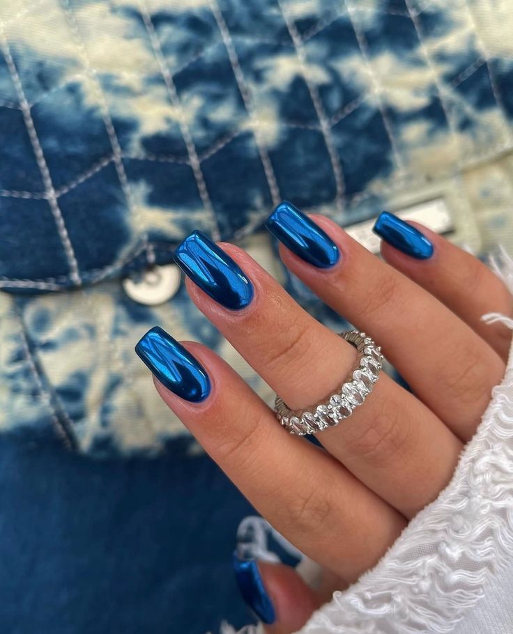 Chic Blue Metallic Nails: Elegant Shine with Glamorous Accents for Any Occasion.