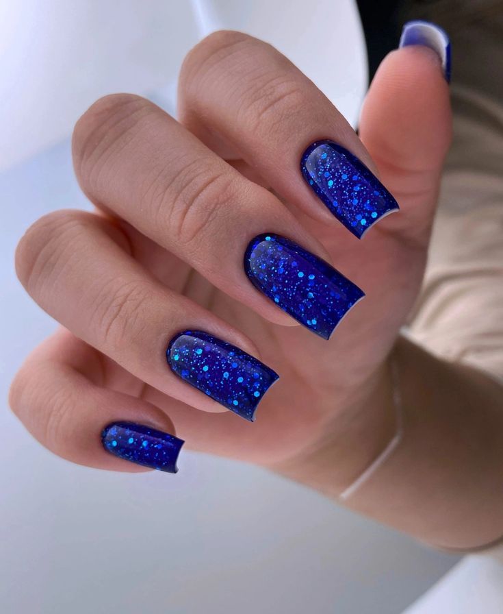 Elegant Dazzling Blue Glitter Nails for a Glamorous Touch.