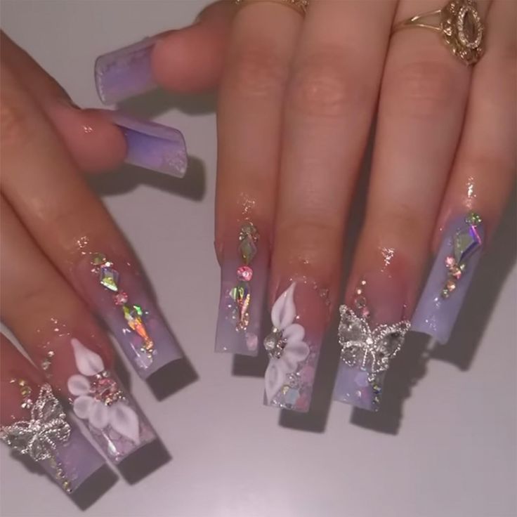 Elegant Lavender Ombre Nails with Intricate Art and Whimsical Butterfly Motifs.