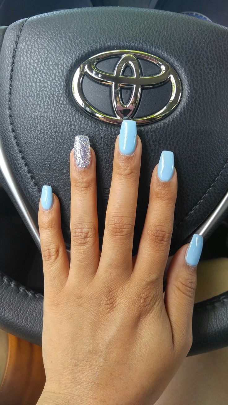 Chic Pastel Blue Nail Design with Sparkling Silver Accent for a Modern Look.