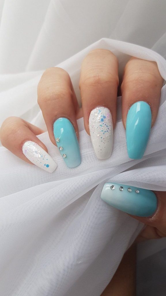 Chic Blue and White Nail Design with Glitter and Rhinestones for Any Occasion