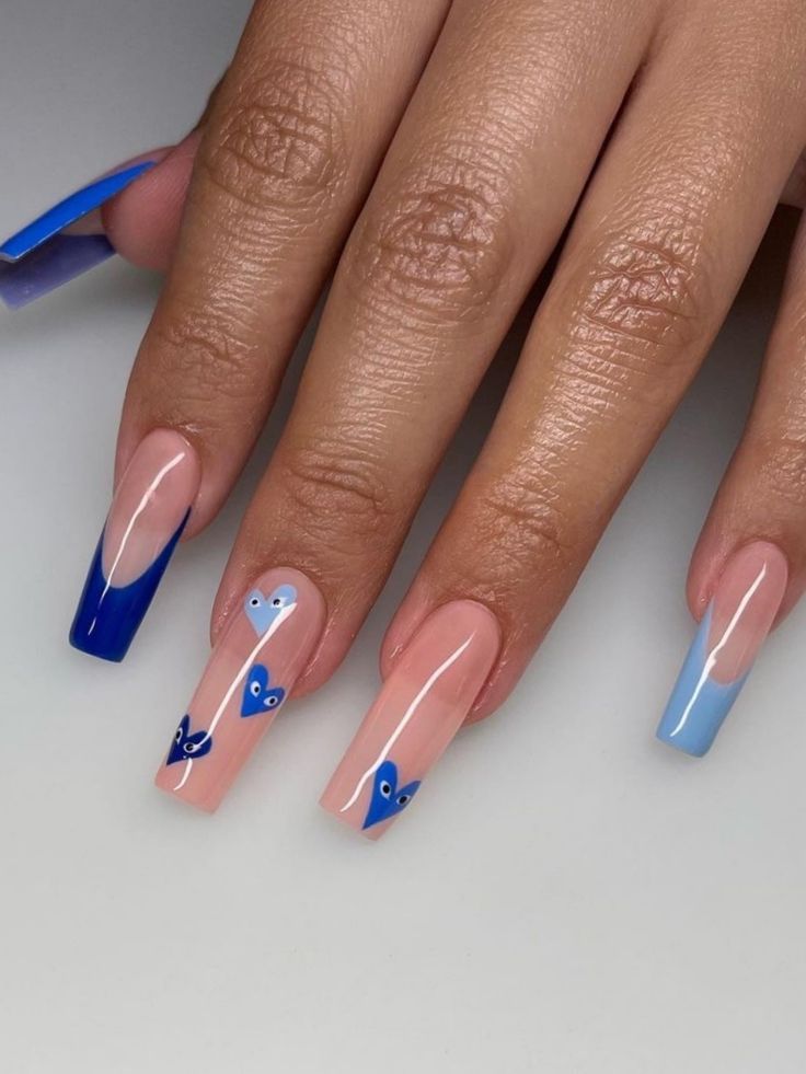 Stylish Gradient Nail Design: Soft Pink and Vibrant Blue with Whimsical Shapes