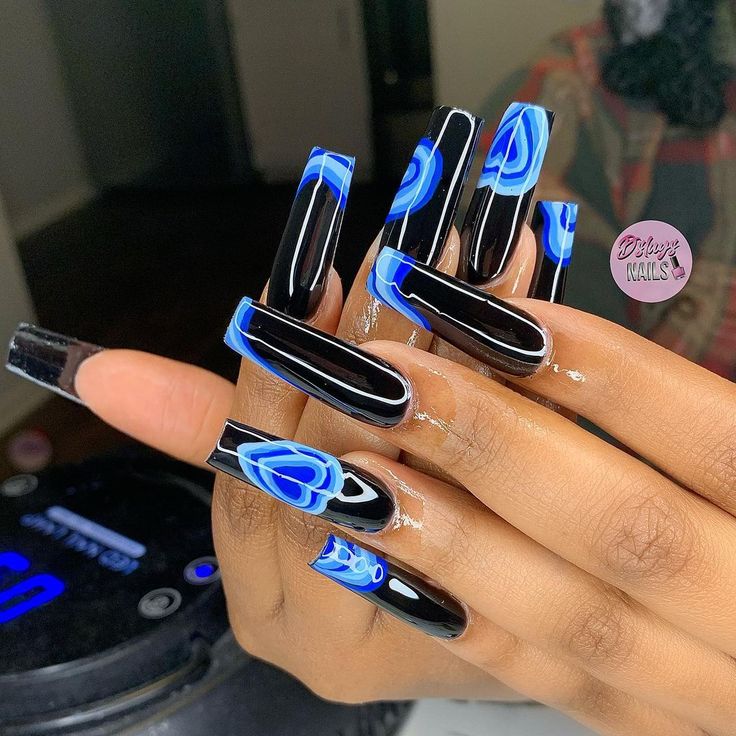 Bold Black Nails with Striking Blue Designs: A Modern Elegance Statement.