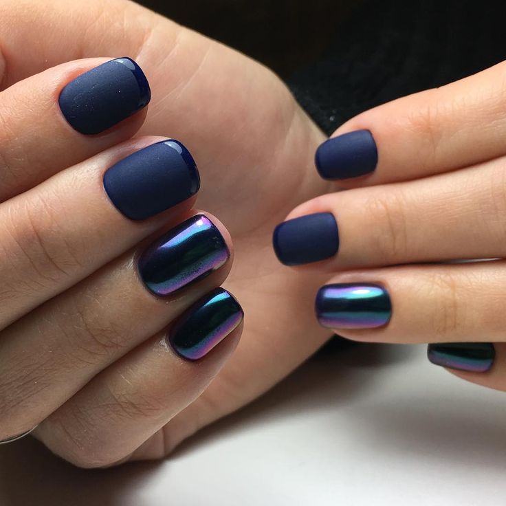 Sophisticated Matte Navy Blue Nails with Iridescent Highlights: A Bold and Elegant Design.