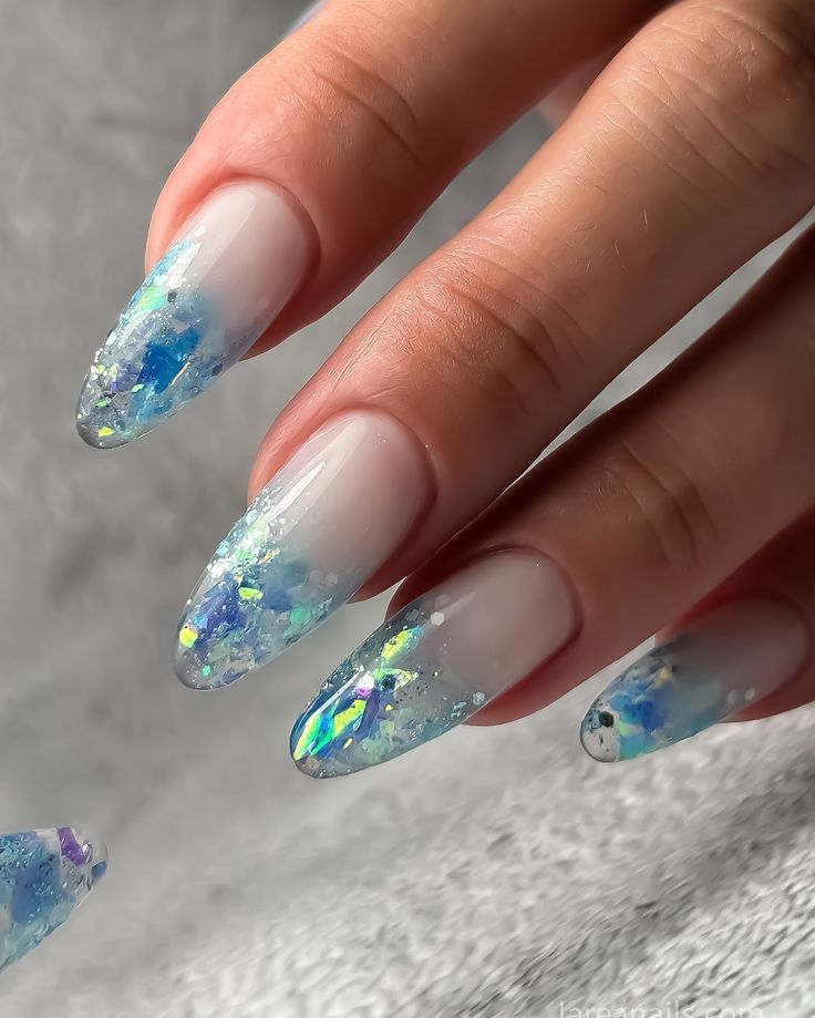 Elegant Pastel Ombre Nail Design with Glittery Tips and Iridescent Flakes