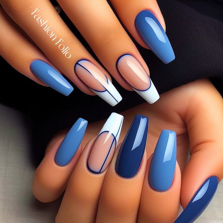 Chic Nail Design: Modern Blue Hues with Glossy Finishes and Geometric Accents.