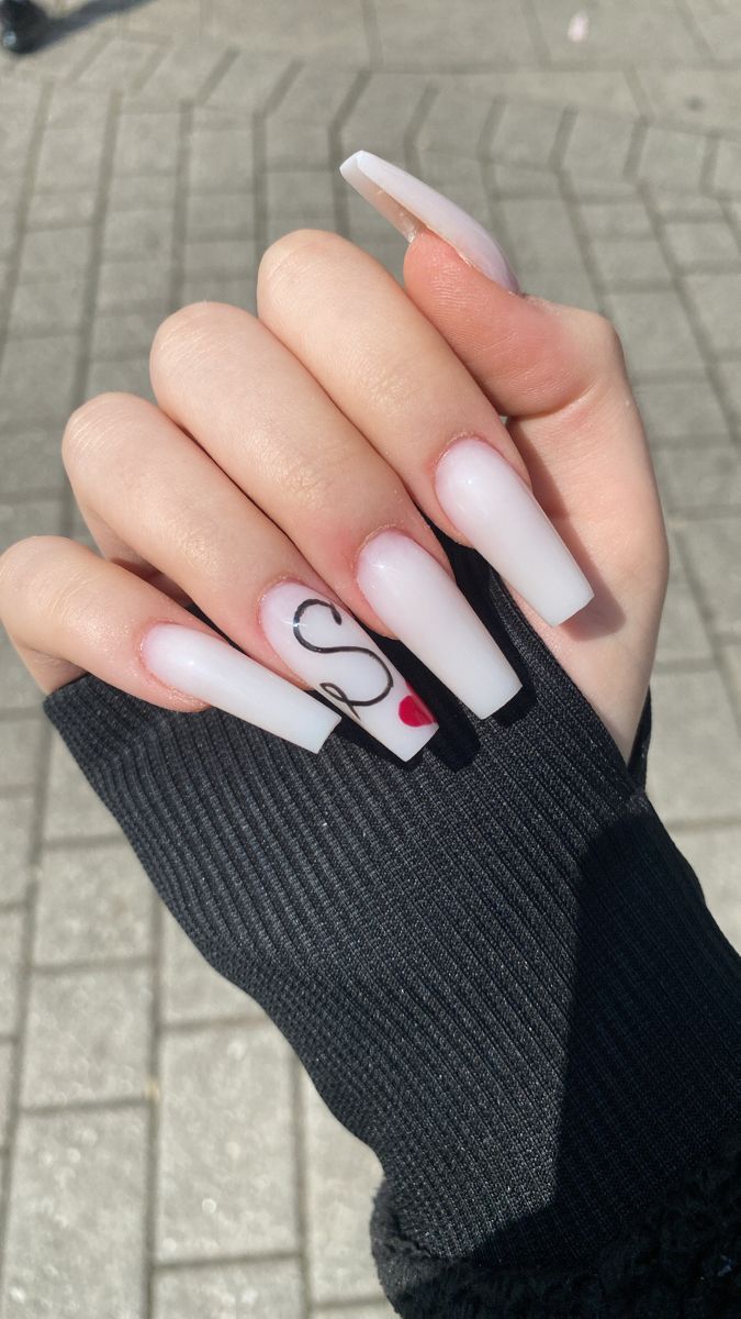 Chic Glossy White Acrylic Nails with Playful Black Letter and Red Accent