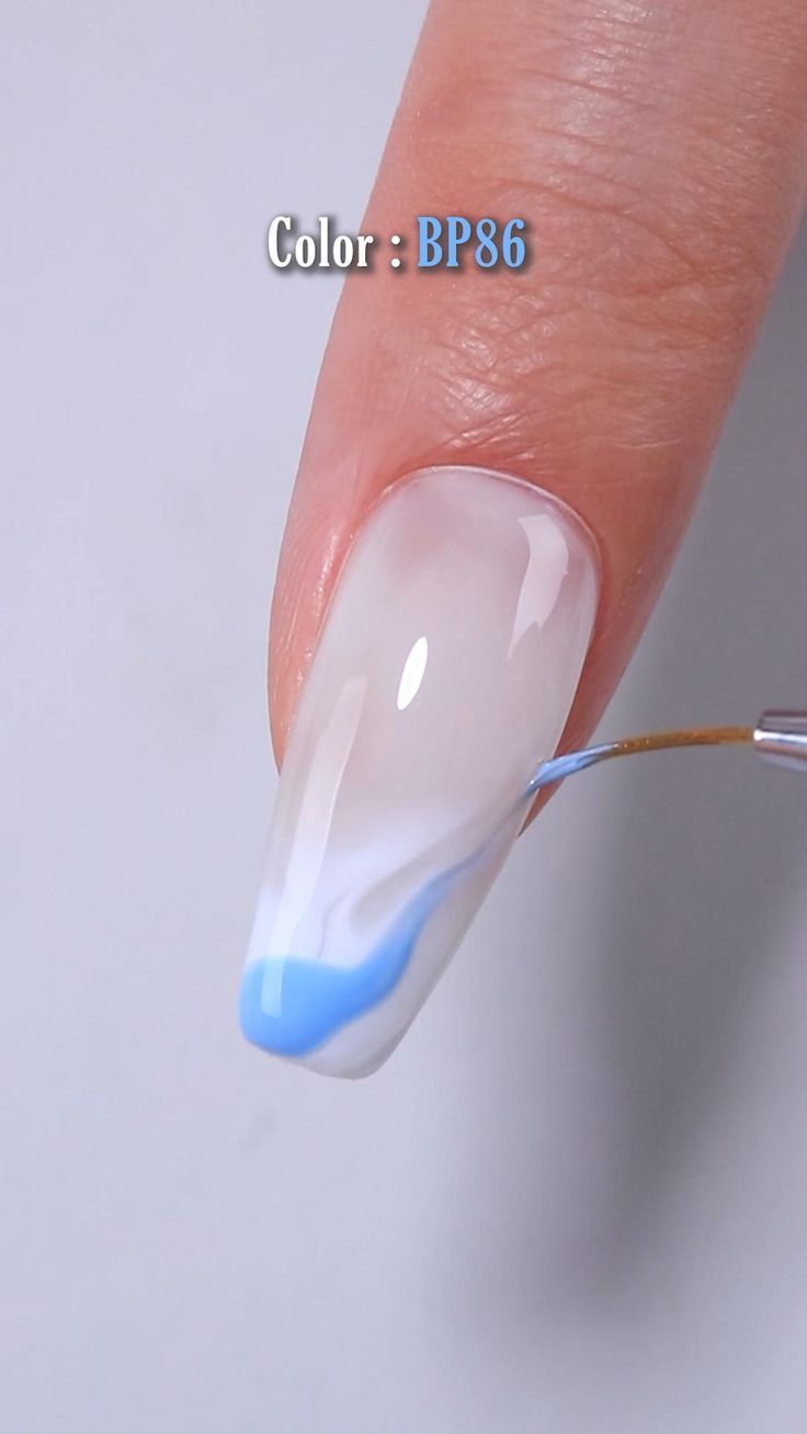 Elegant Translucent Nail Design with Soft Gradient and Delicate Blue Swirl.