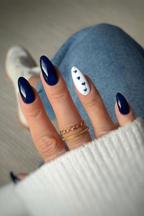 Elegant Navy Blue Nails with Charming Heart Accent for a Perfect Occasion Blend