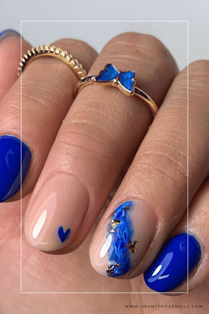 Vibrant Blue Accented Nail Design: Elegance Meets Creativity with Minimalistic Charm.