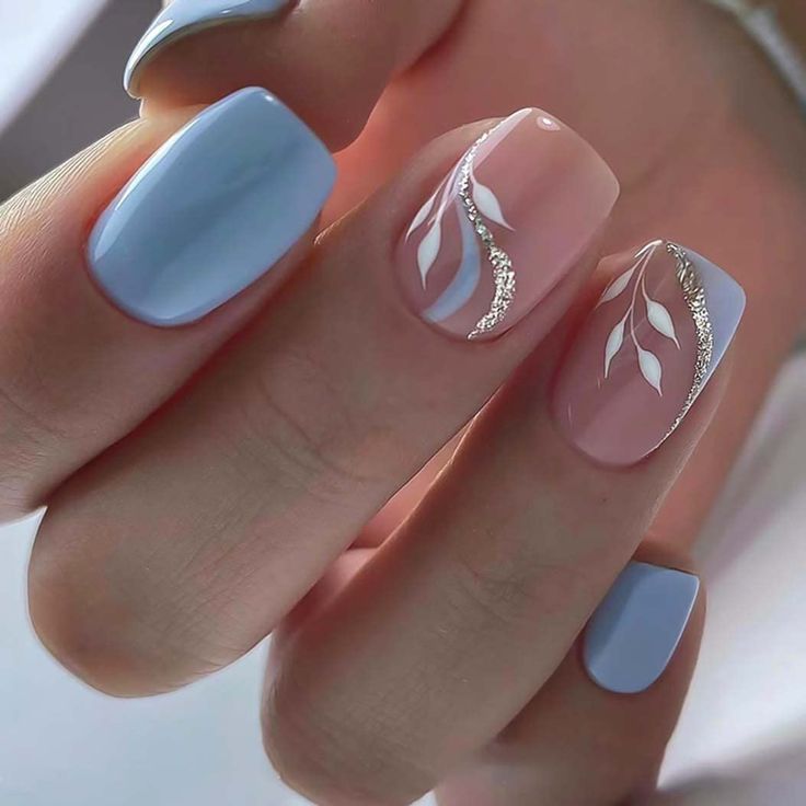 Elegant Soft Blue and Pastel Pink Nail Design with Sophisticated Leaf Patterns and Silver Accents