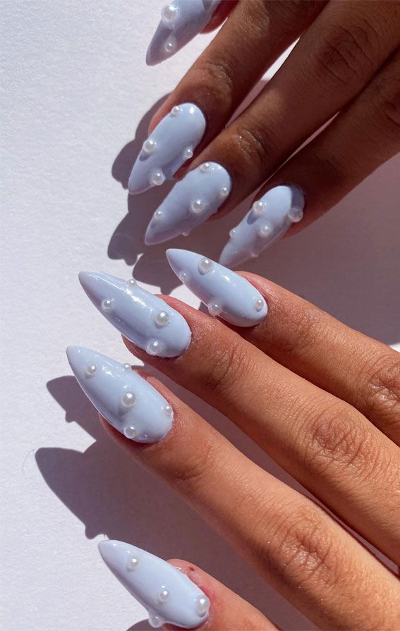 Chic Pastel Blue Almond-Shaped Nails Embellished with White Pearls.