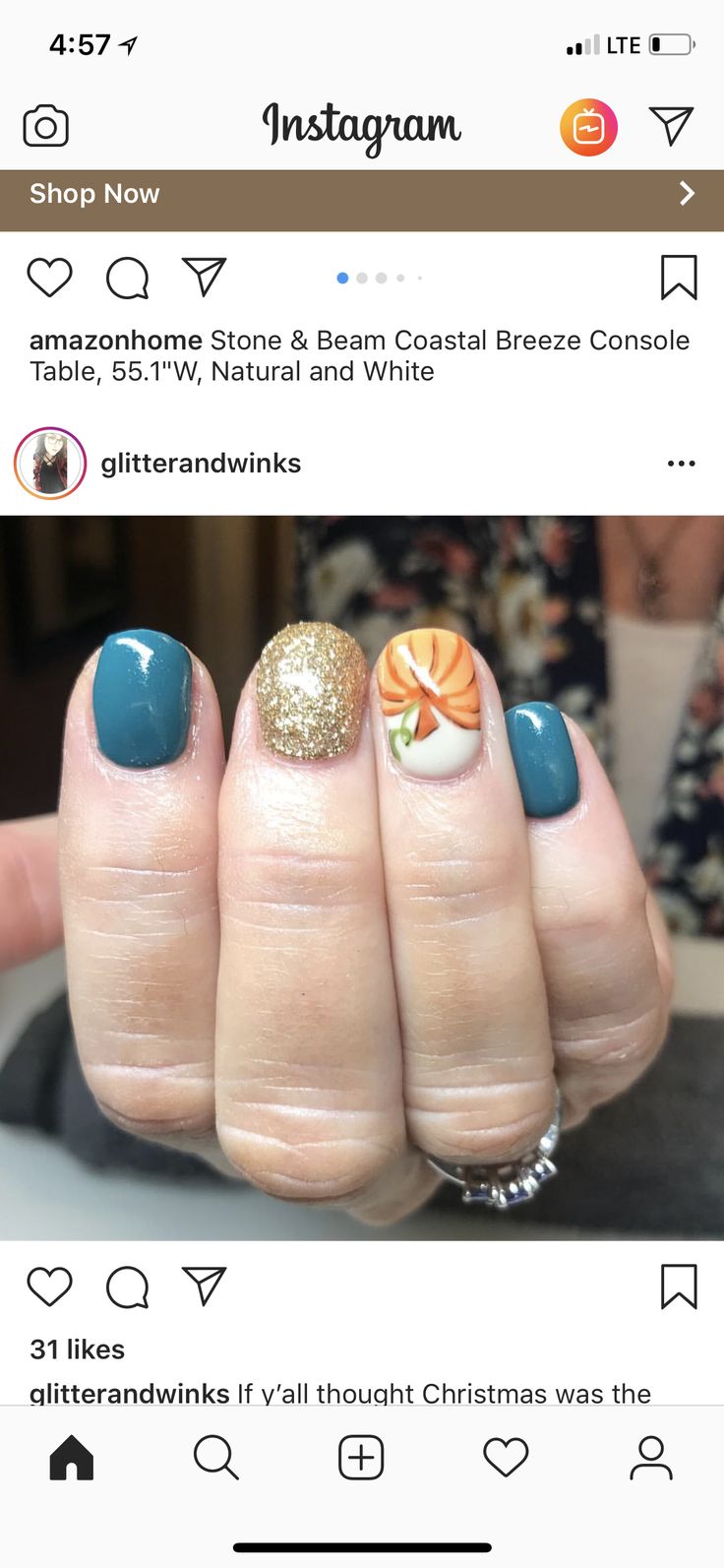 Festive Teal and Gold Glitter Nail Design with Pumpkin Accent for Seasonal Cheer.