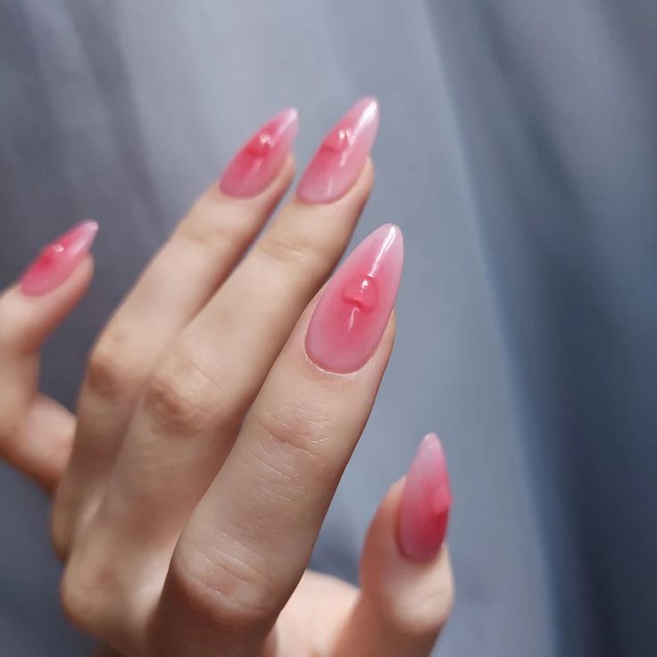 Elegant Pink Gradient Stiletto Nails: A Striking Yet Delicate Design for Any Occasion.