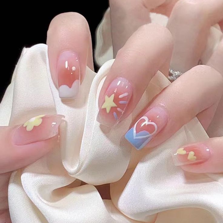 Charming Playful Pastel Nail Design with Whimsical Motifs.